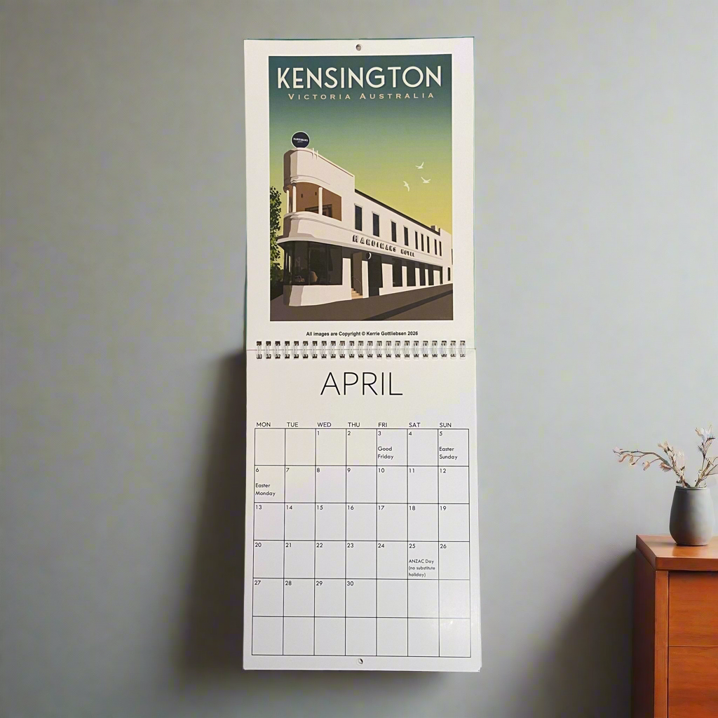 Calendar with a building design on a wall, featuring the month of April.