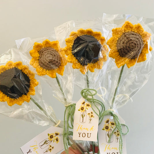 handmade crochet sunflower in yellow and brown wool, on a sturdy wire stem with a thank you card attached for adding your own message