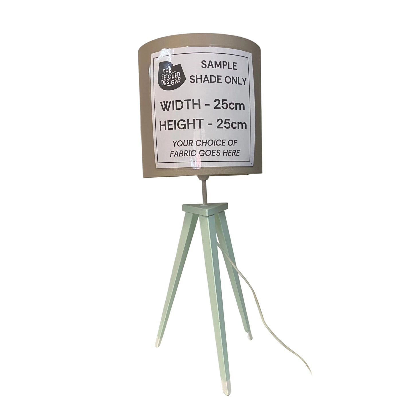 Lampshade on a stand with a sample size label in a store setting