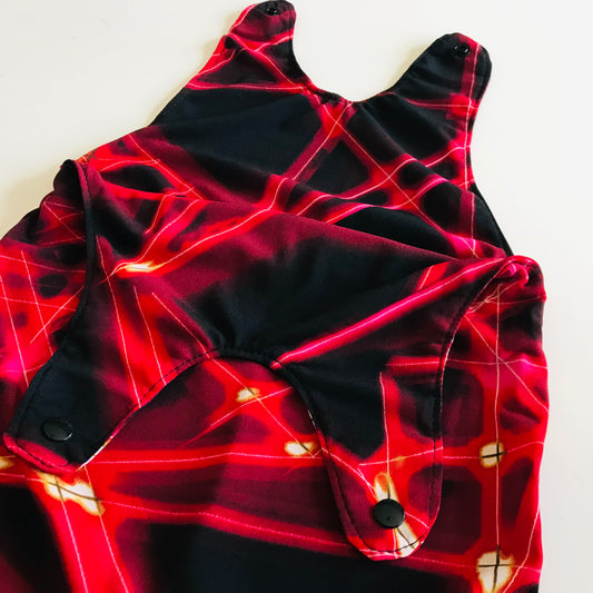 Red and black patterned garment on a white background