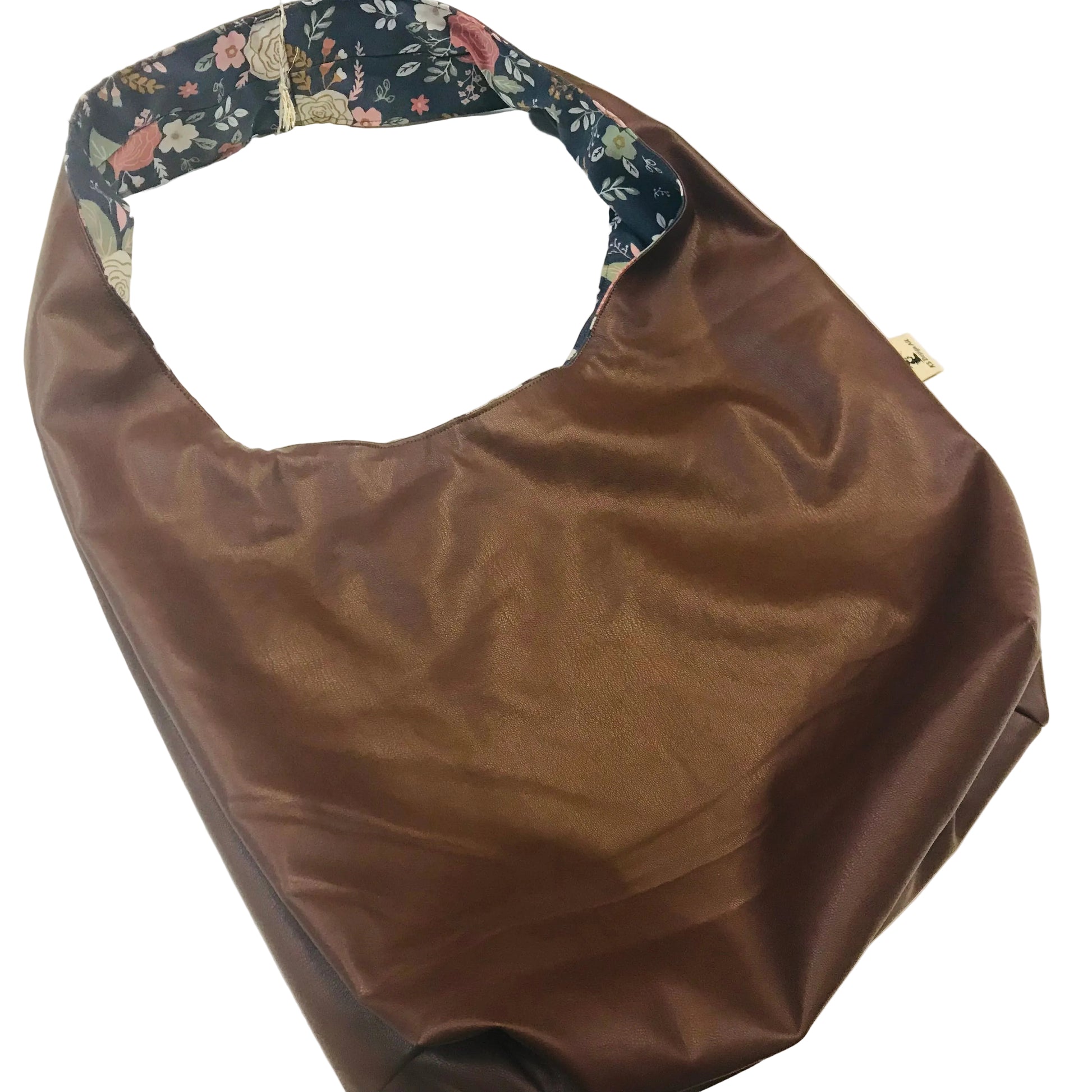A brown faux-leather hobo shoulder bag with a floral-patterned fabric lining visible along the inner edge of the strap, shown on a plain white background.