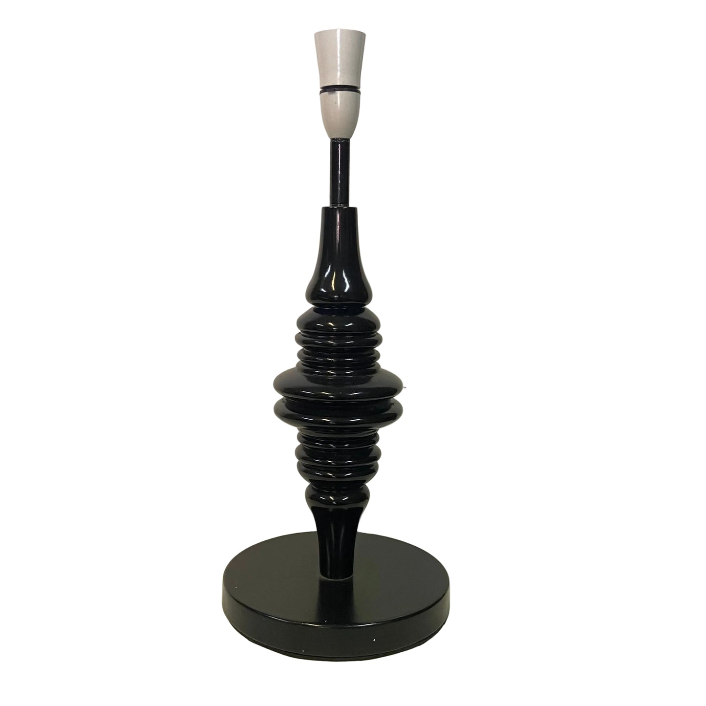 Black table lamp with a textured design on a white surface.