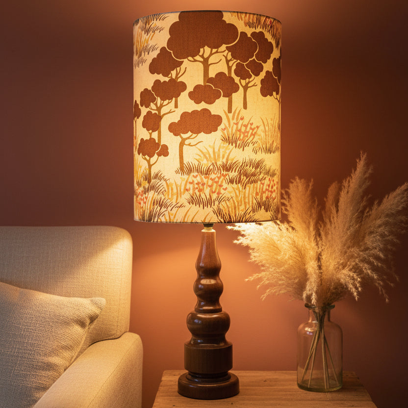 Lamp with a decorative lampshade featuring tree patterns 