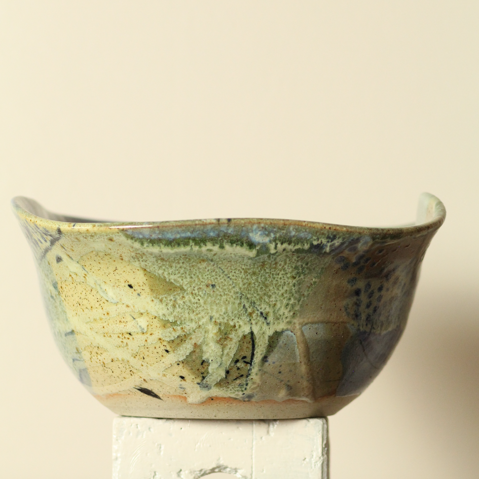 Ceramic bowl with a textured surface on a beige background