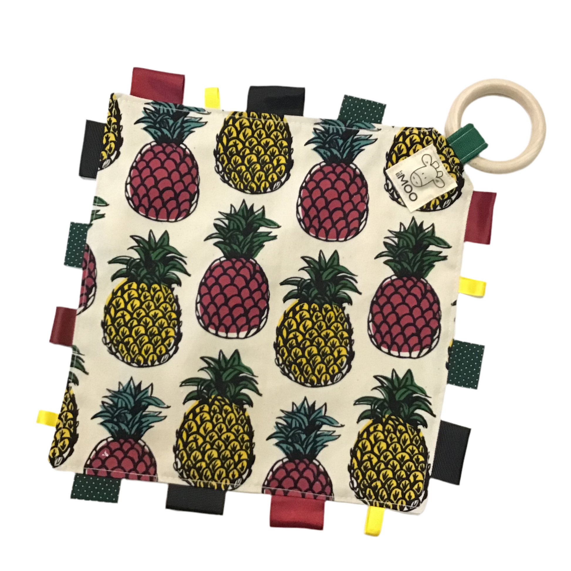 Baby comfort taggie teether with pineapple pattern and wooden ring on a white background