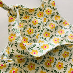 kids overalls with tie shoulders and yellow flower print, made of pinwale cord