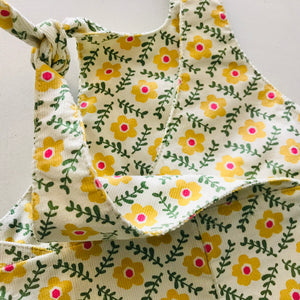 kids overalls with tie shoulders and yellow flower print, made of pinwale cord