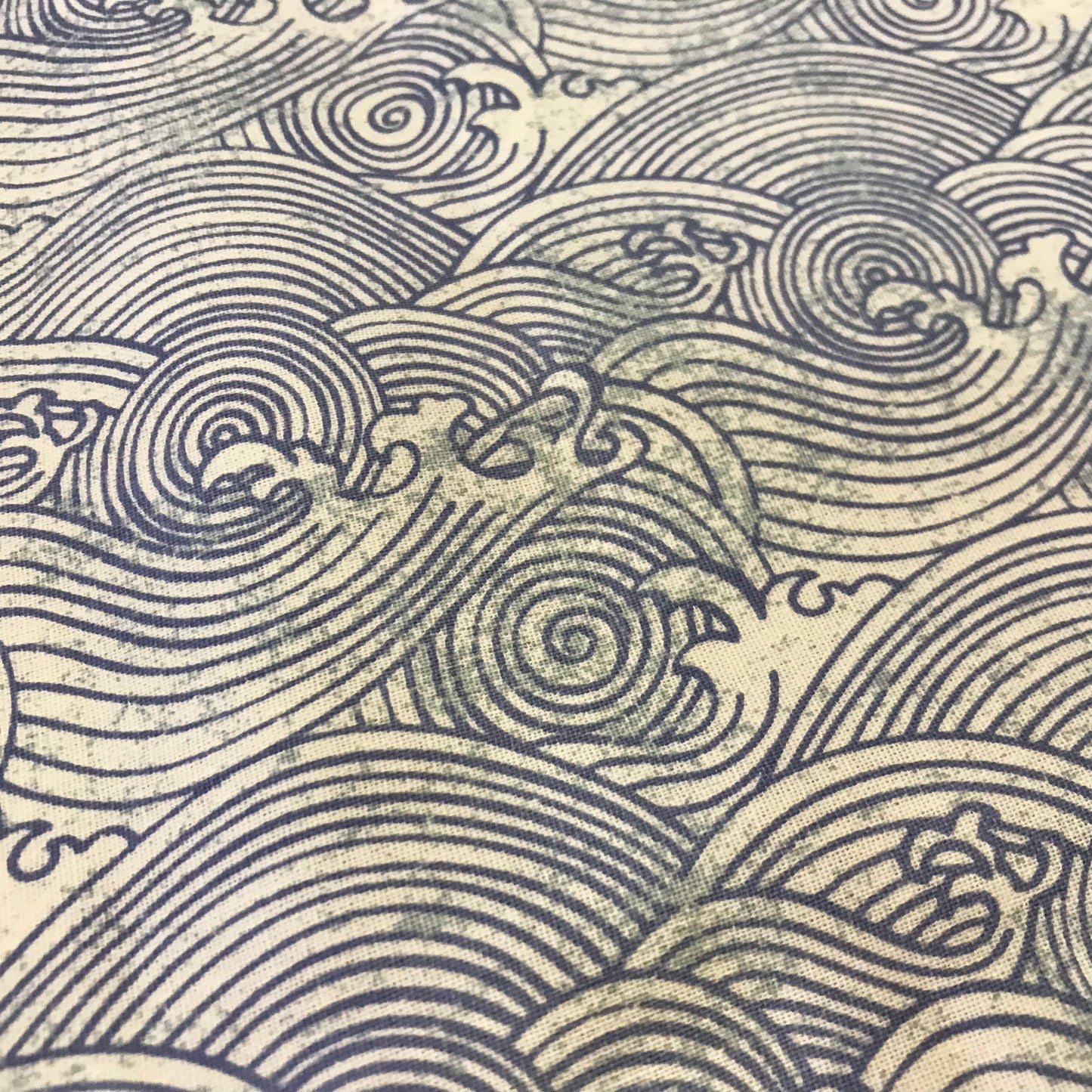 Decorative pattern of stylized waves in blue on a beige background