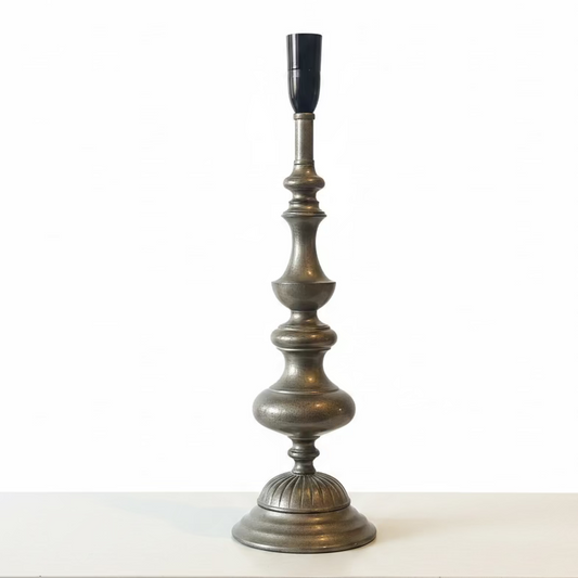 A vintage-style metal candlestick lamp base with a fluted pedestal design, on a white background