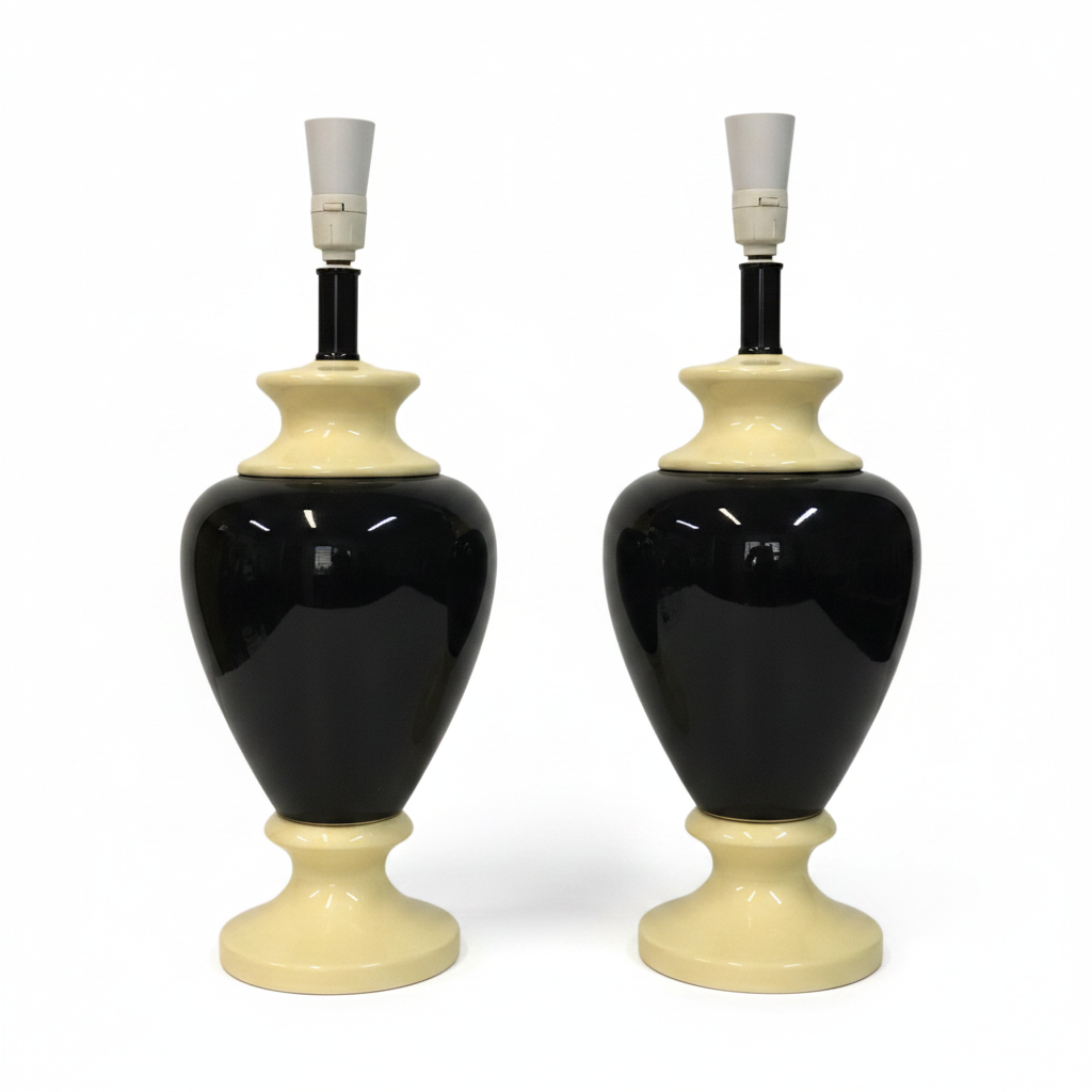Two black and cream ceramic table lamps on a white background