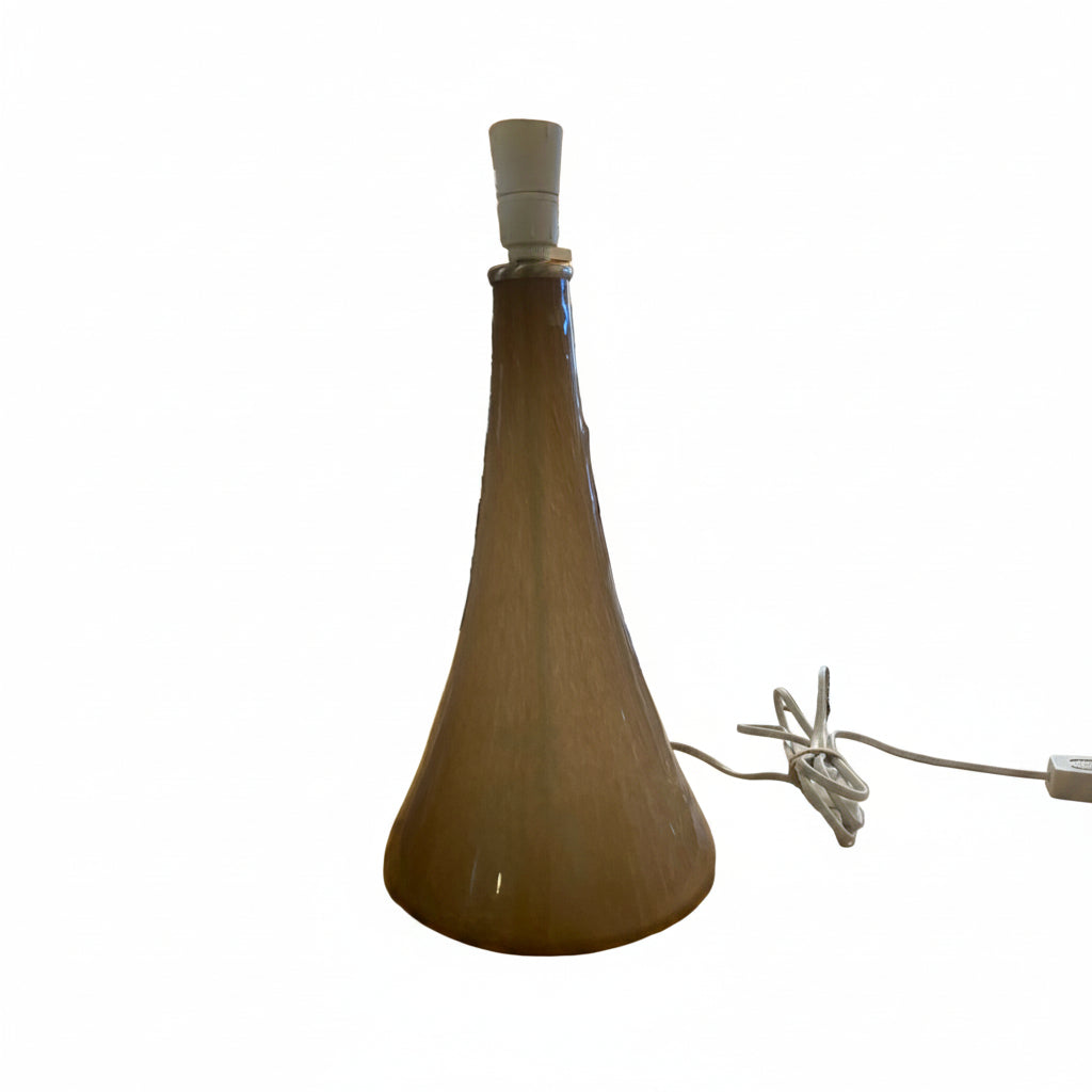 Tall, brown glass lamp base with a white base on a white background