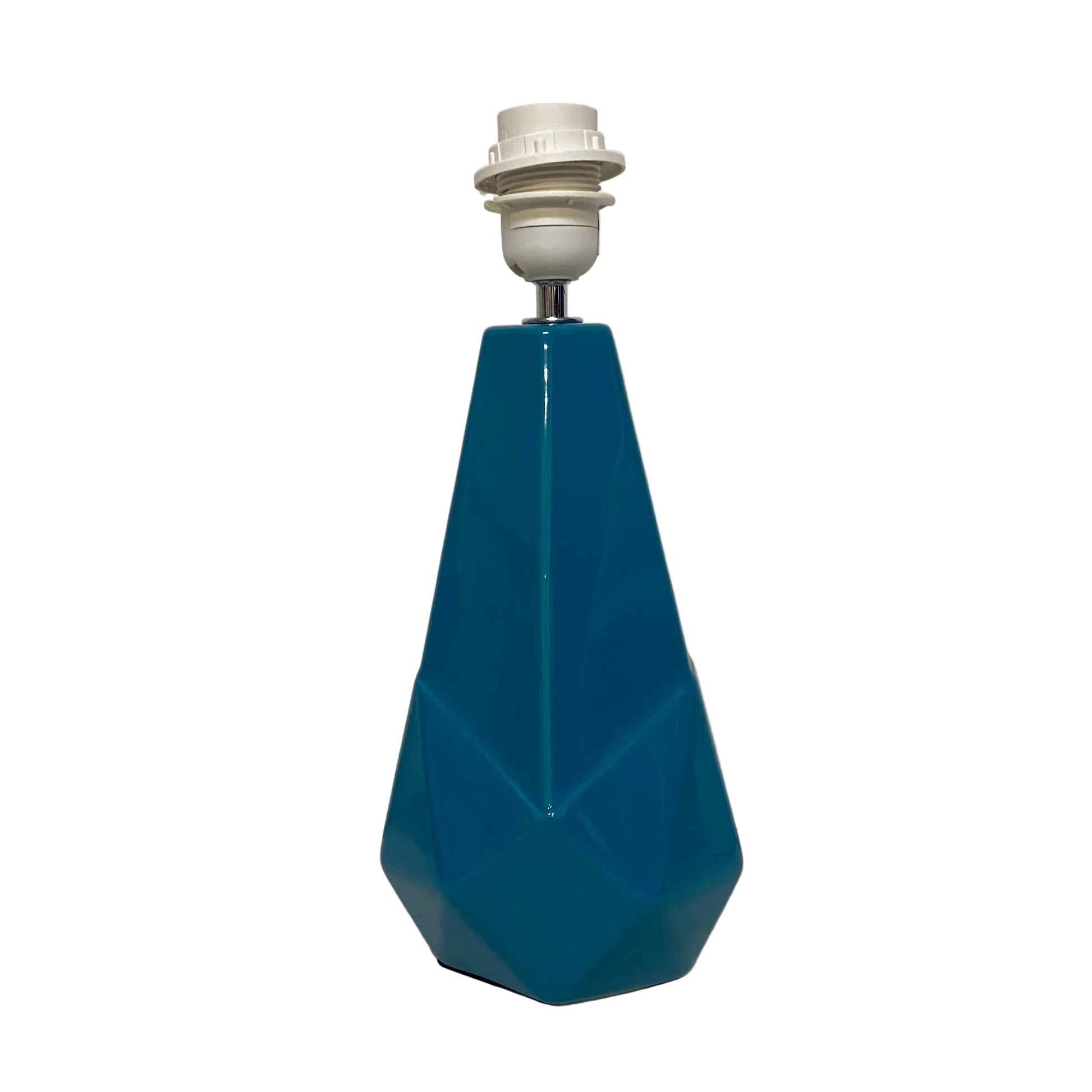 Blue geometric lamp with white base on a light gray background