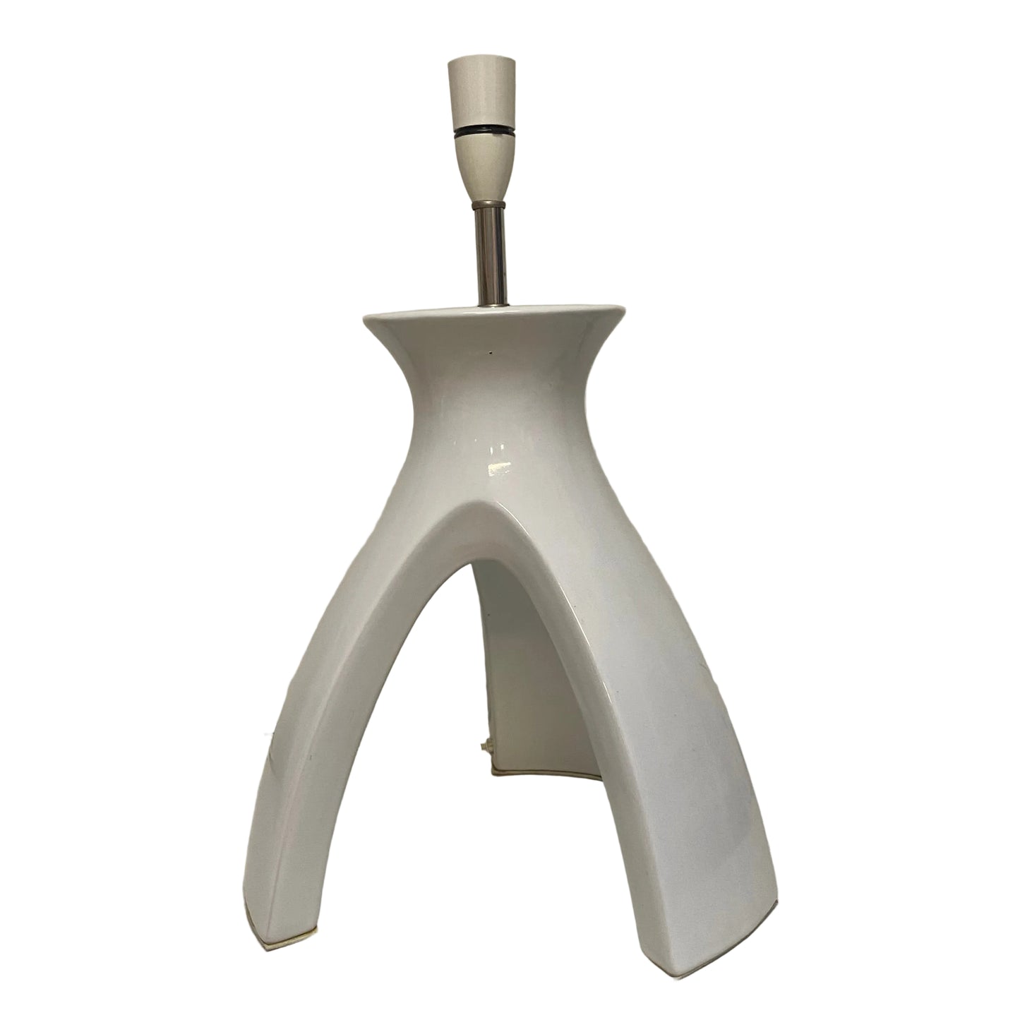 White ceramic lamp base on a plain background