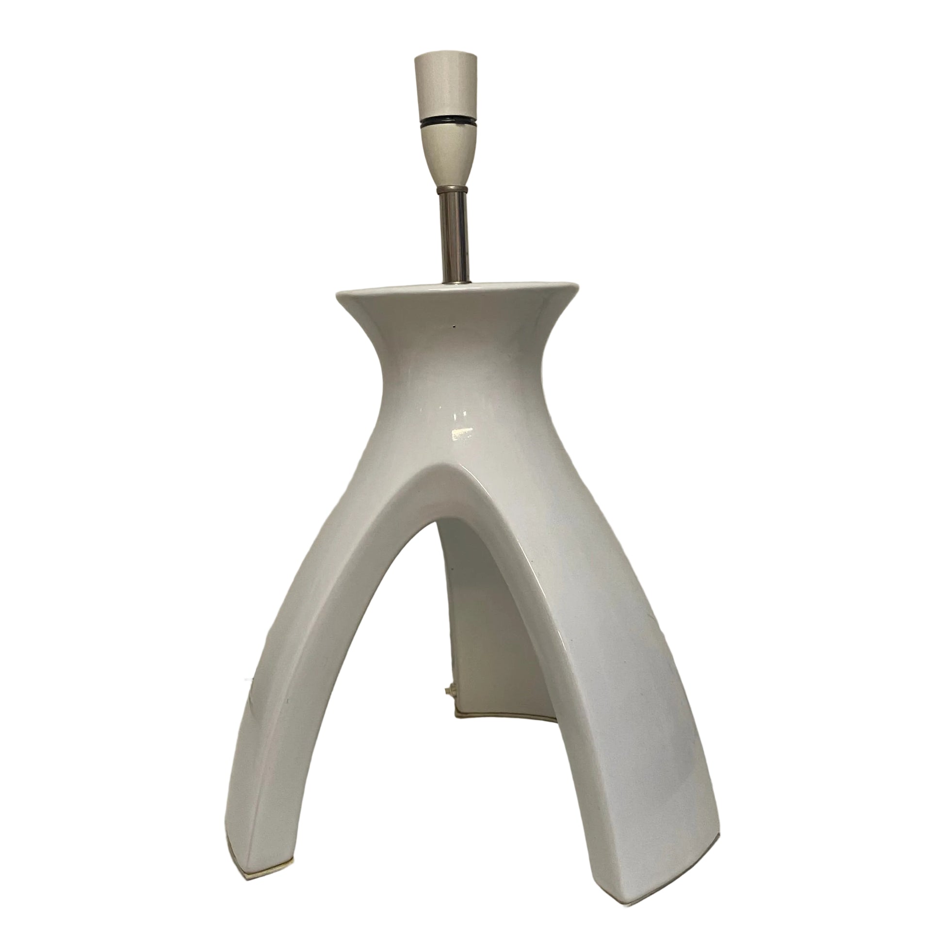 White ceramic lamp base on a plain background