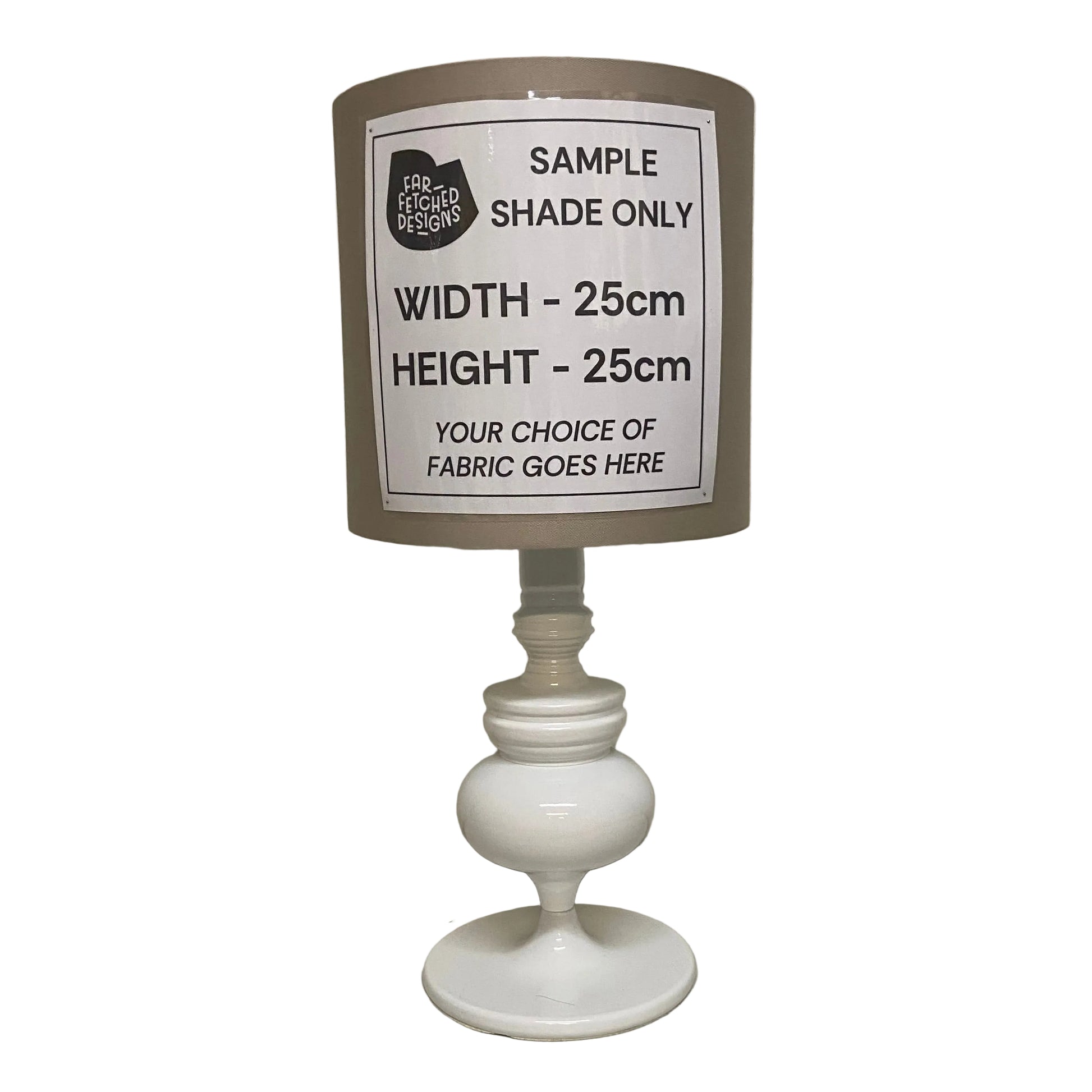 Lamp with a sample shade label on a plain background