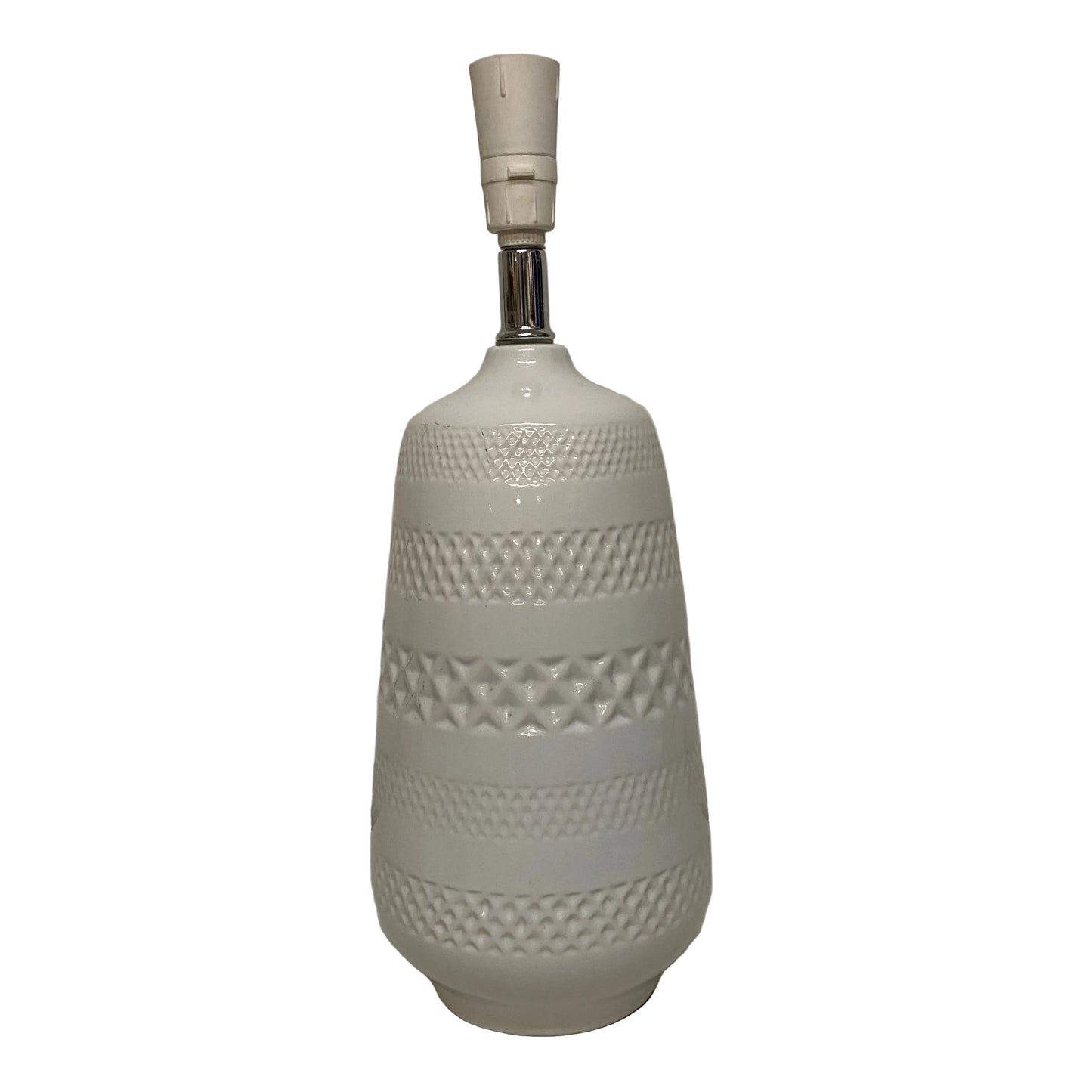 White textured lamp on a plain surface with a neutral background