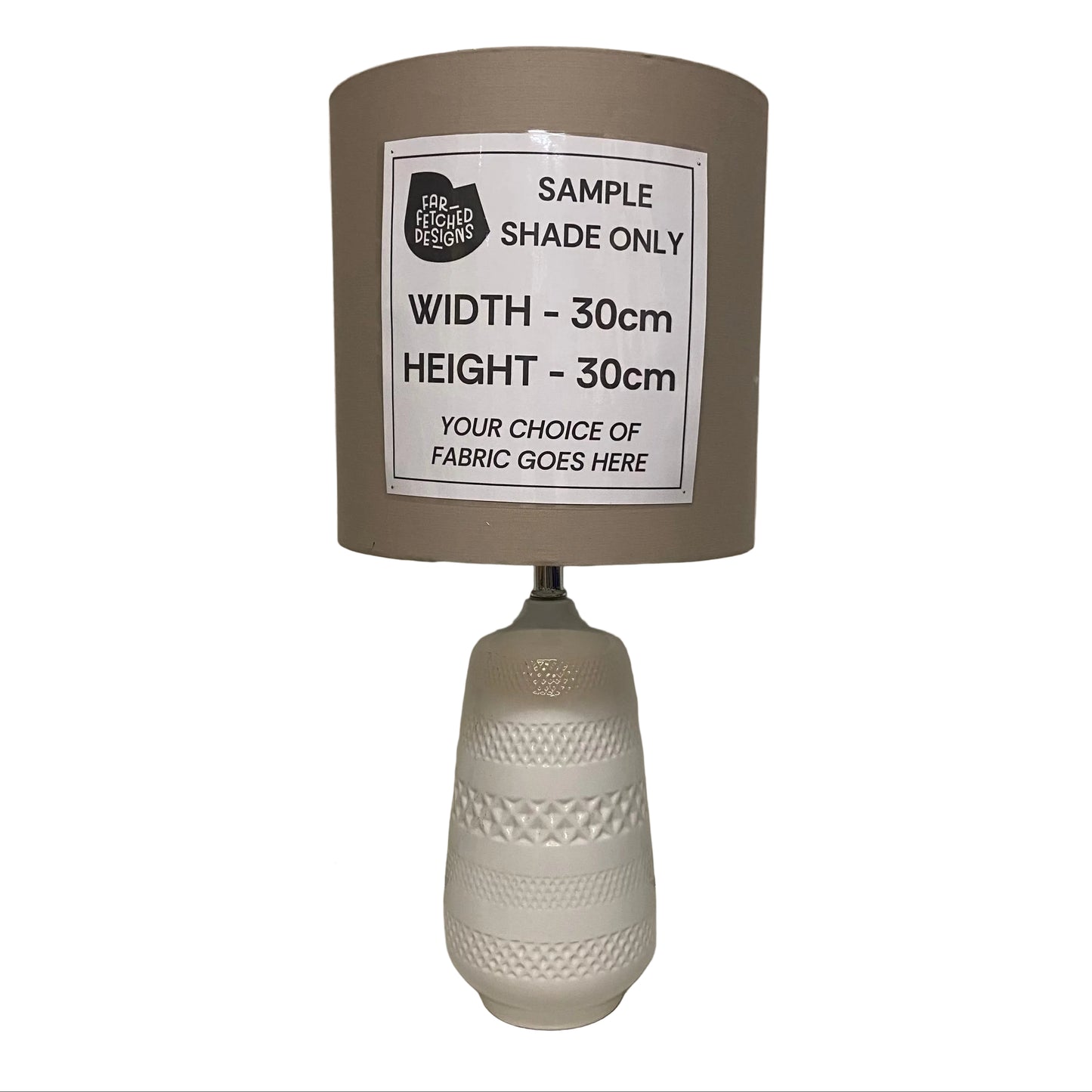 Lamp with a sample shade label on a plain background