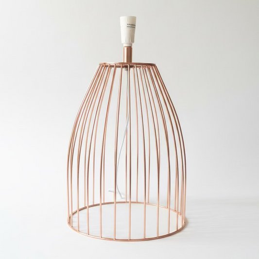 A copper wire cage table lamp with white sockets, photographed on a clean white background.
