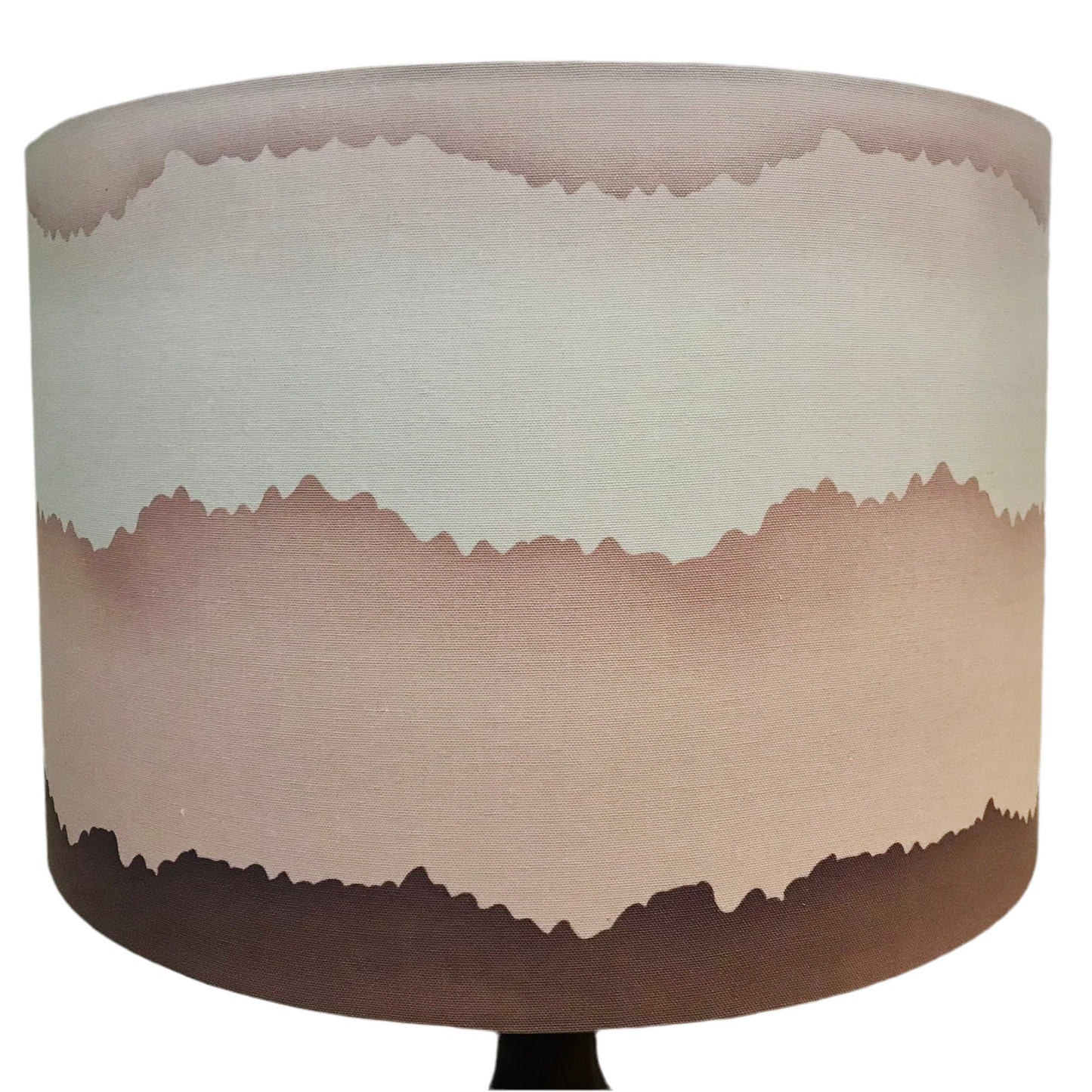 An extra large carved hardwood table lamp with a musk shade, featuring a gradient of pink at the top fading into a darker shade towards the base.