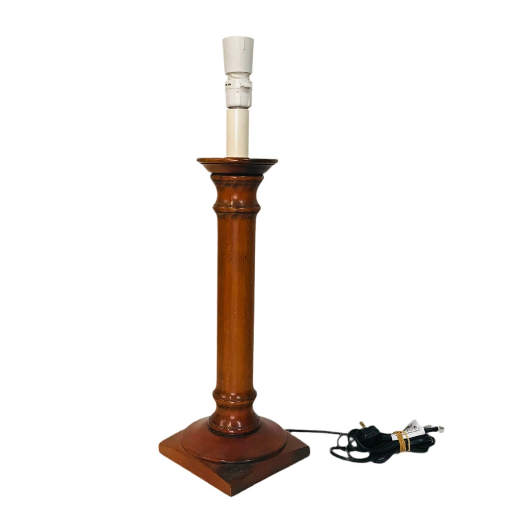 Wooden lamp with white shade on a white background
