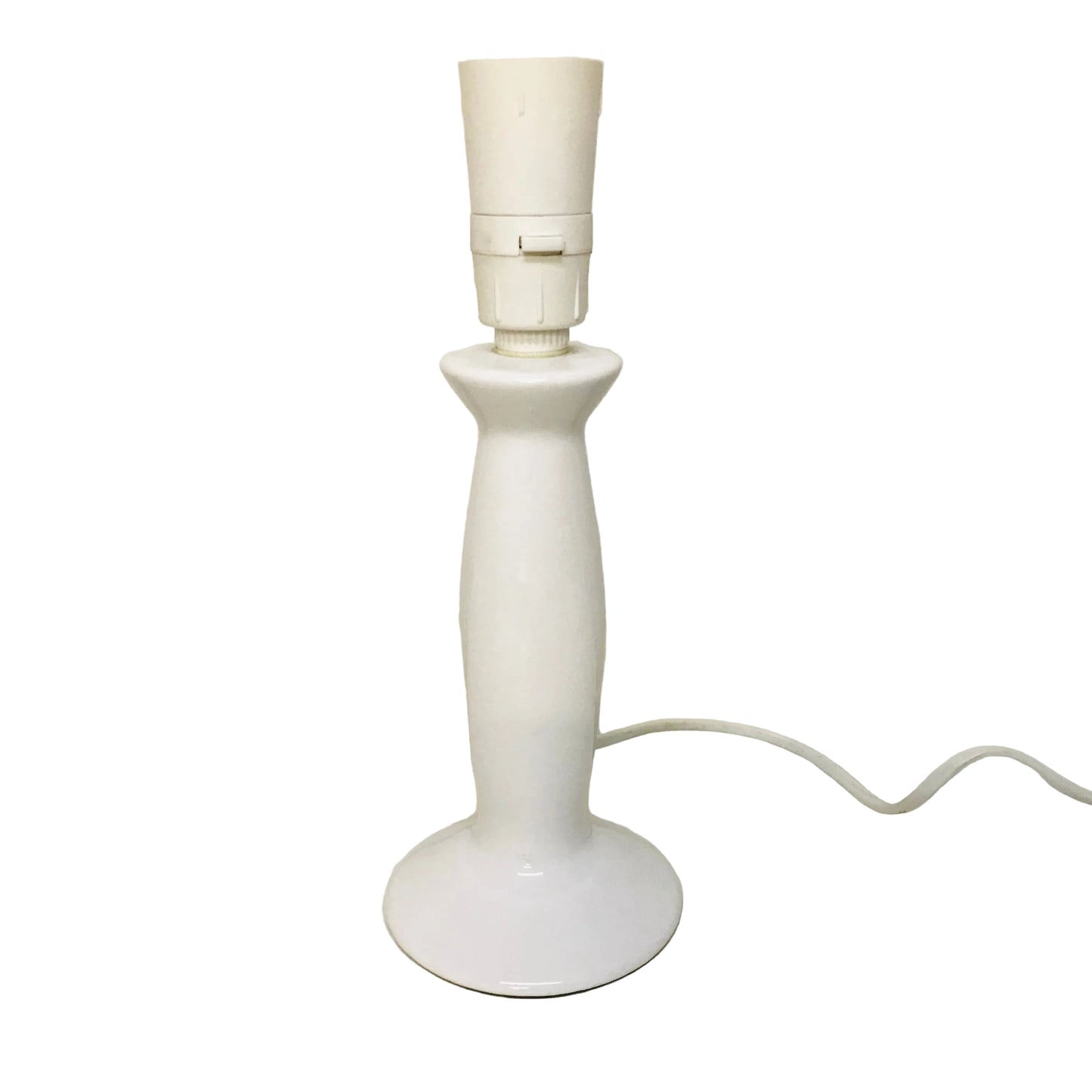 White table lamp on a white surface with a plain background