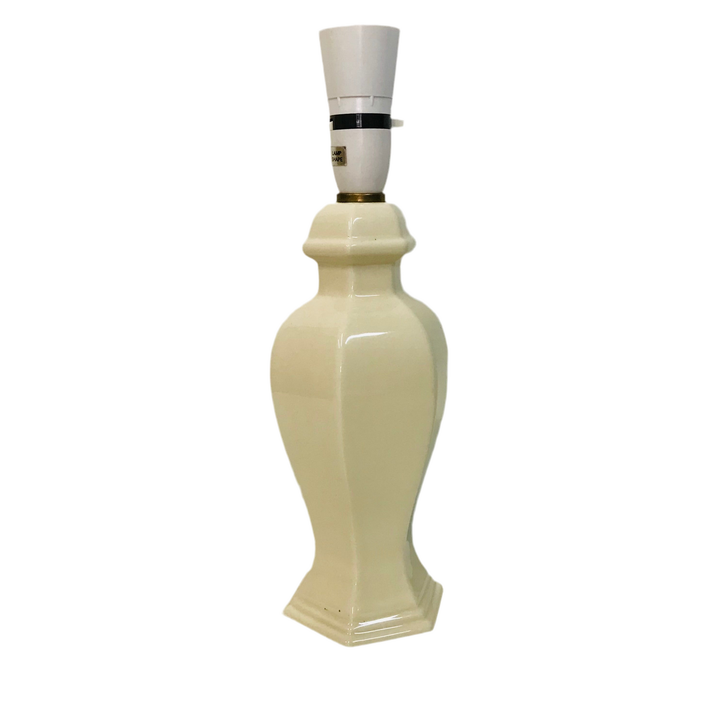 White ceramic lamp with a hexagonal base on a white background