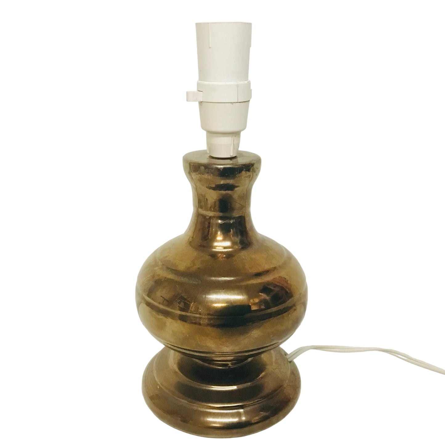 Brass lamp with white bulb on a white background