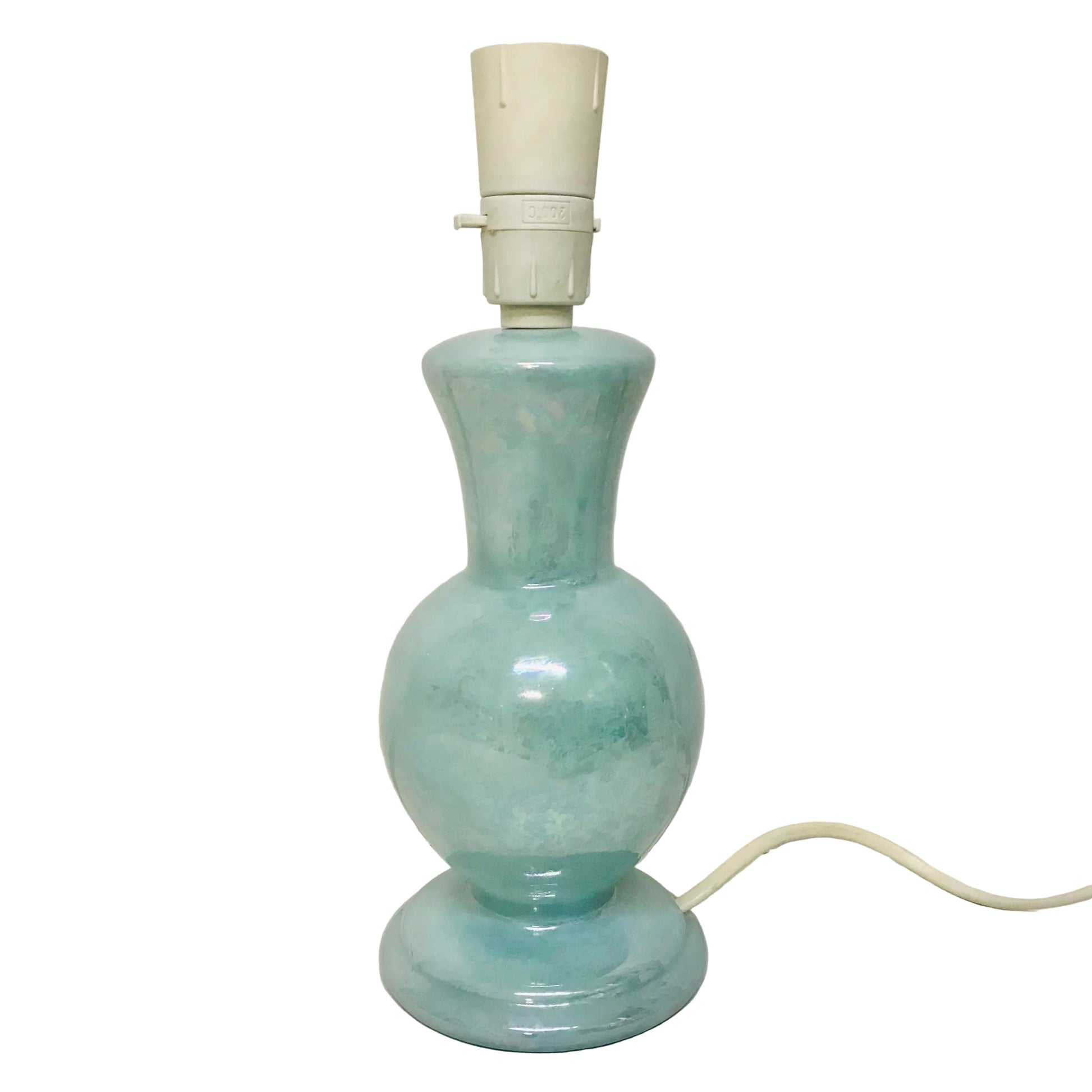 Light blue ceramic lamp with white base on a white background