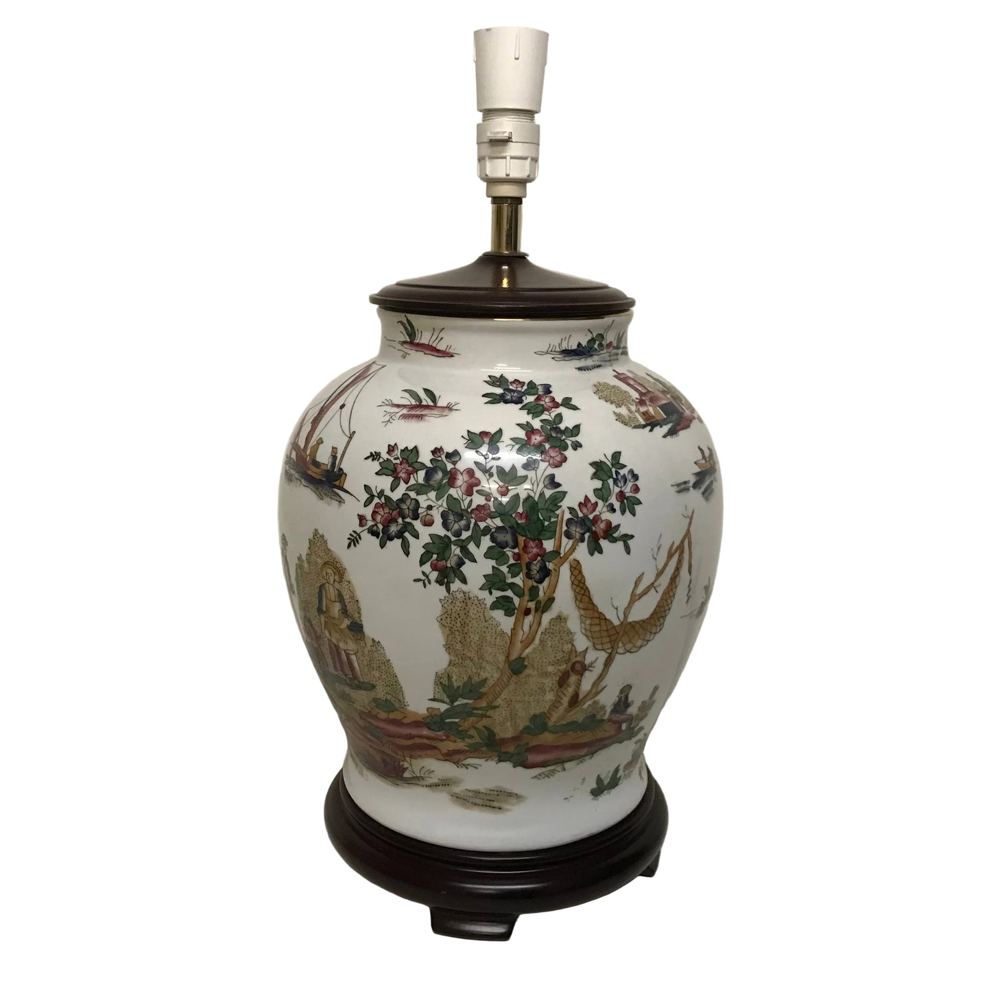 Decorative ceramic lamp with floral and bird patterns on a plain background