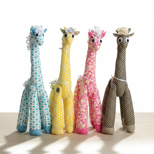A collection of handmade soft toy giraffes in various colors and patterns standing upright.