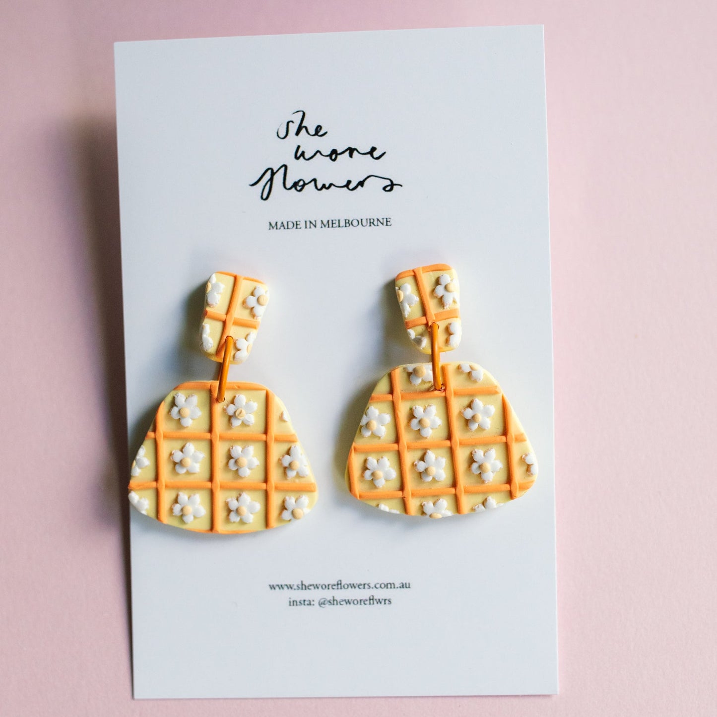Waffle pattern earrings on a card with 'The Wowe Flowers' branding on a pink background