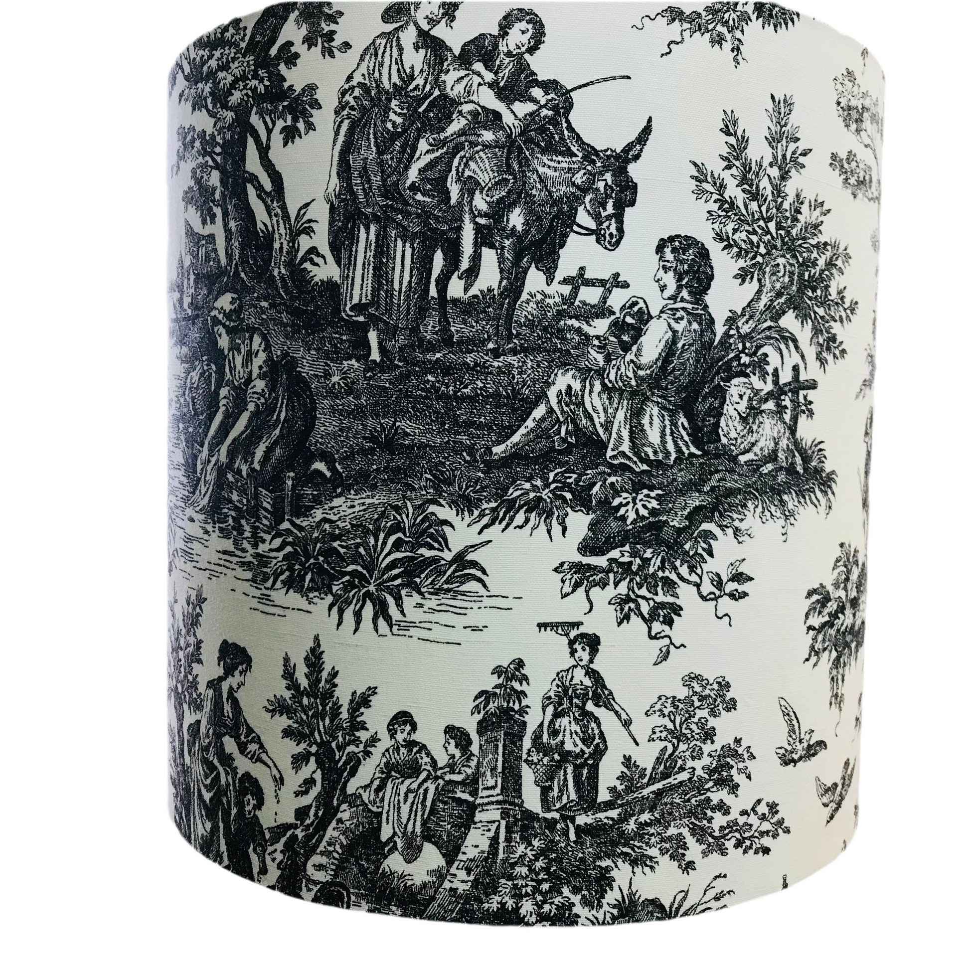 Decorative cylindrical lampshade with black and white vintage-style design featuring people and animals.