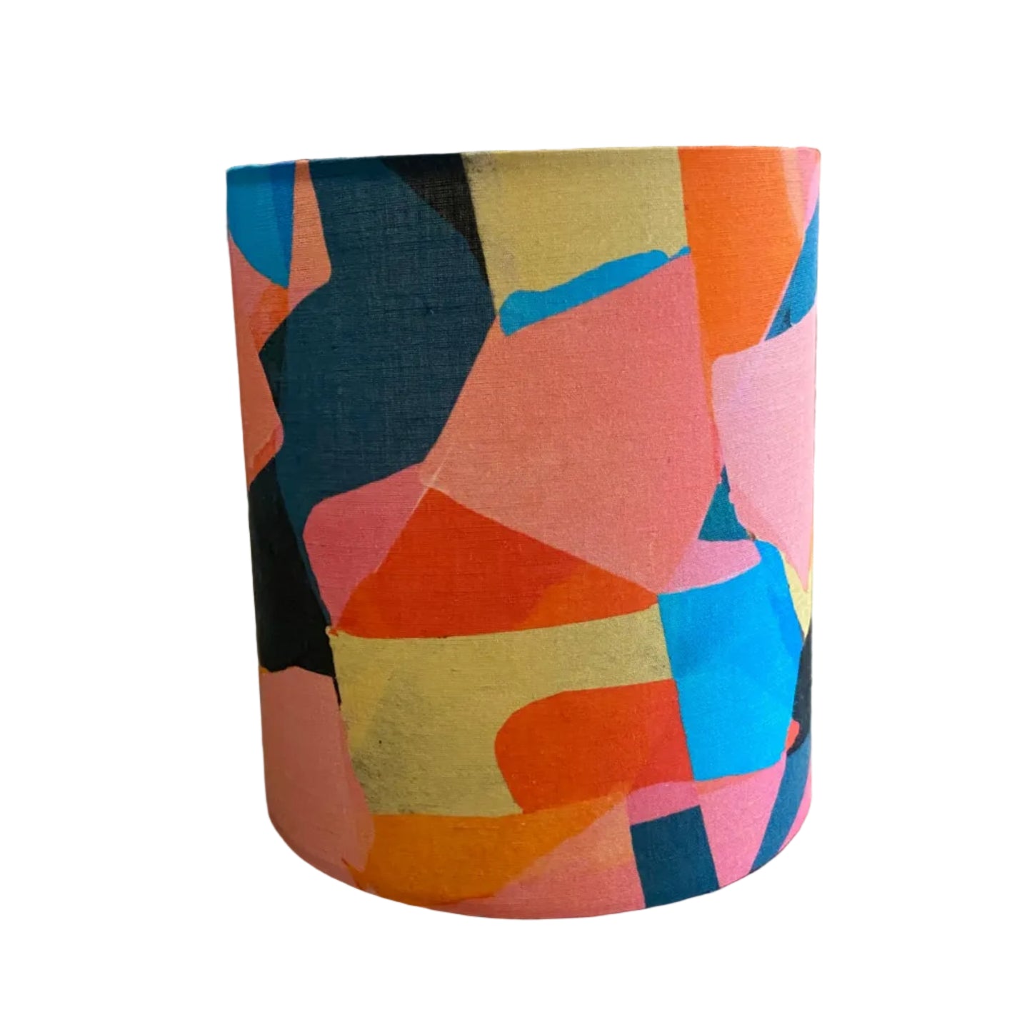 A cylindrical lampshade featuring a vibrant, abstract geometric pattern with overlapping shapes in pink, orange, blue, yellow, and black on a clean white background.