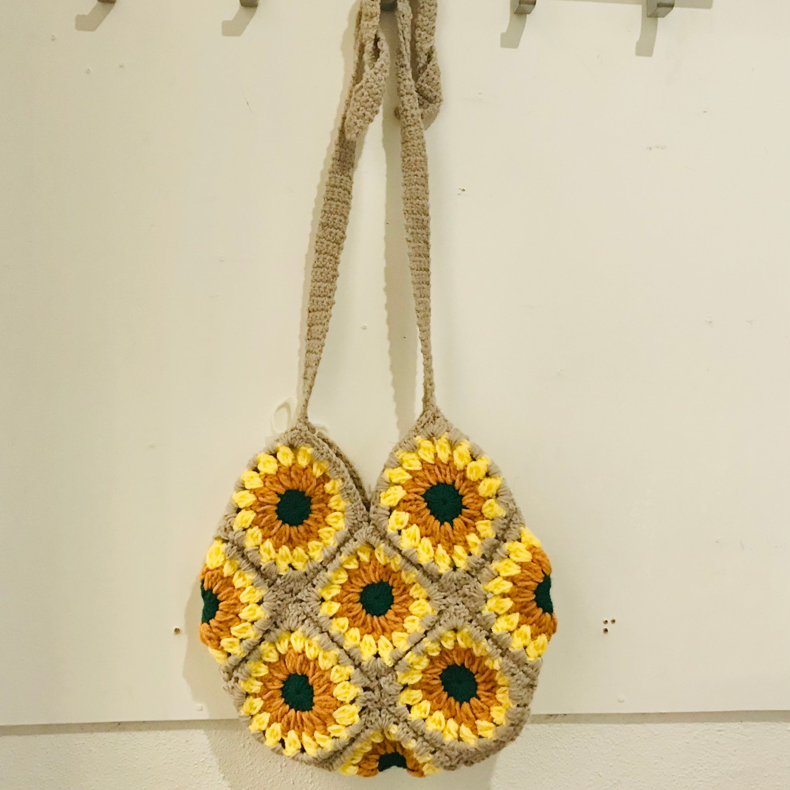 handmade crochet granny square shoulder bags with adjustable straps in tan and yellows
