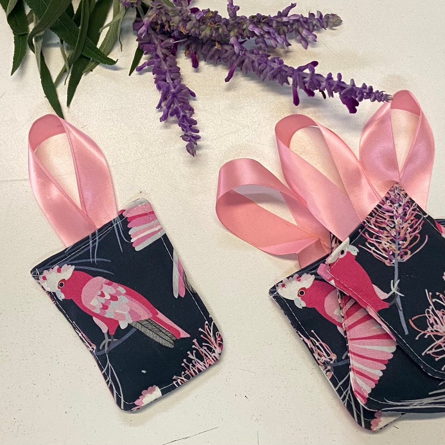 small hanging pouch filled with lavender to hang in your wardrobe or place in your clothing drawers to leave the space gmelling fresh. This set of four pouches have a floral featuring a galah textile.