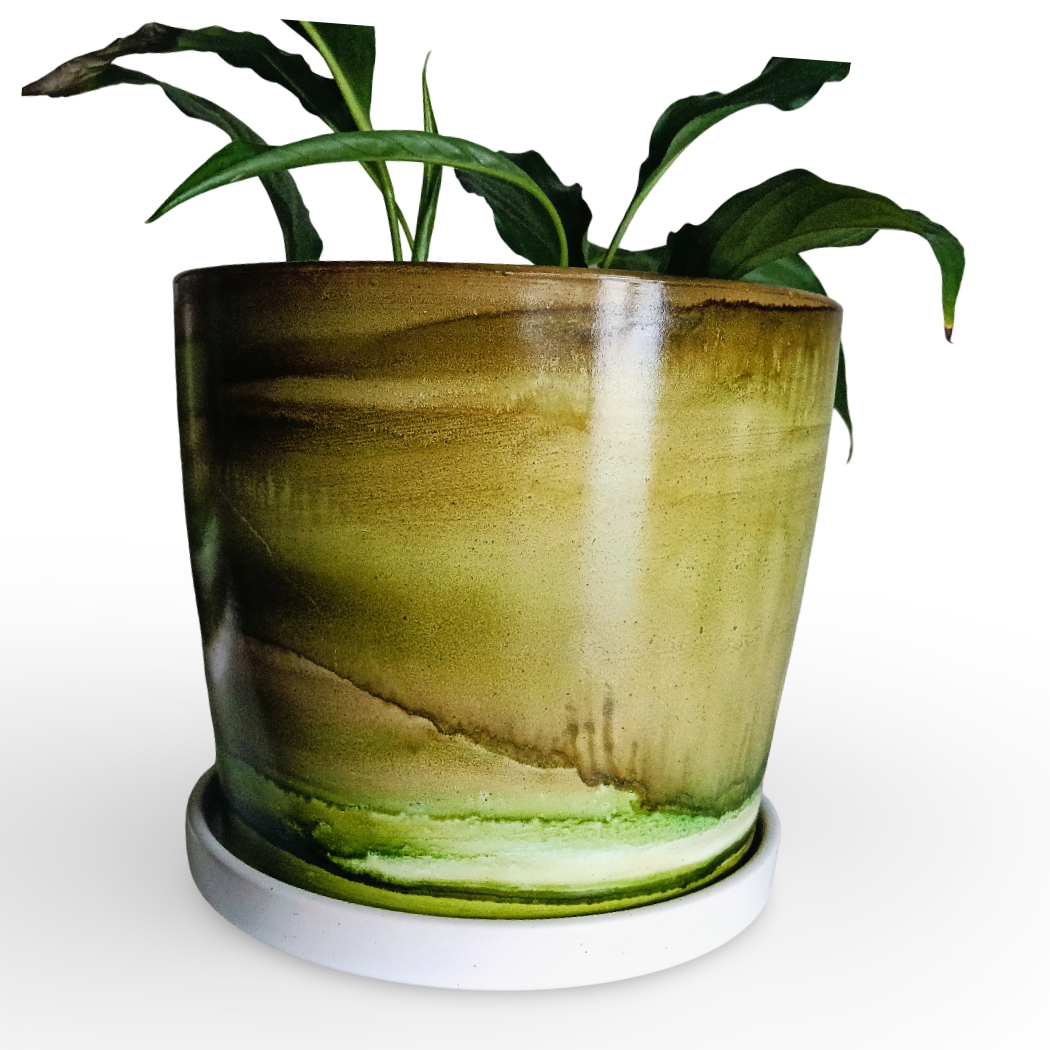 A green glazed ceramic planter with a matching white saucer, holding a leafy green plant, set against a plain white background with a 'art creation' watermark in the top right corner.
