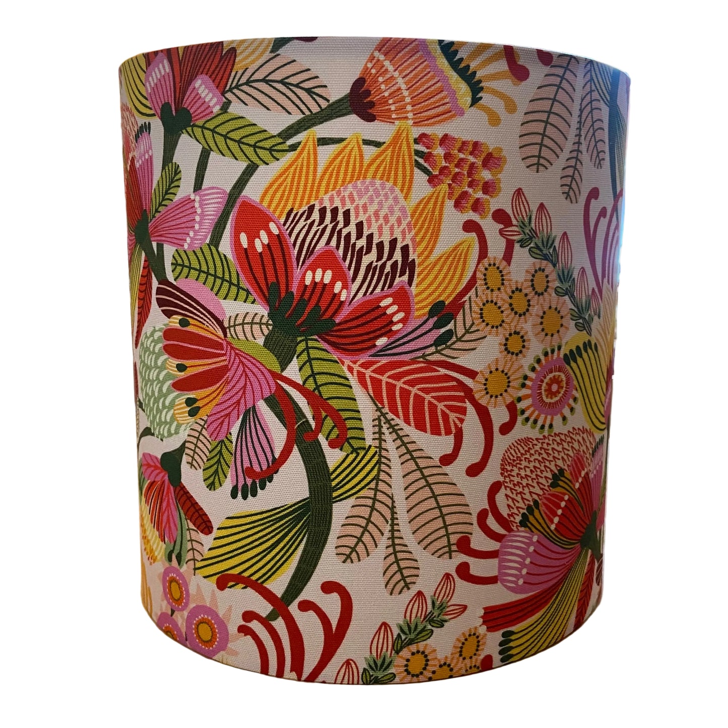 A drum lampshade featuring a vibrant, multicolored floral and botanical pattern on a white background, displayed on a white background